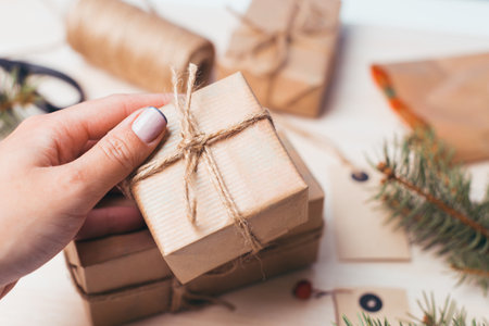 Wrapping holiday gifts with care and creativity in a cozy indoor setting