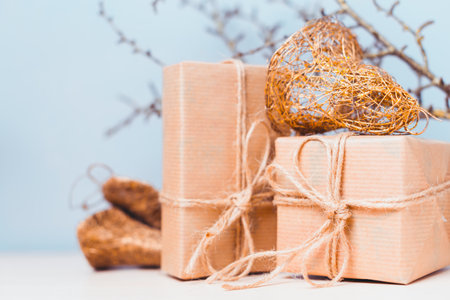 Gift wrapped packages with decorative accents in a cozy setting