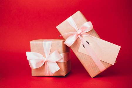 Wrapped gifts ready for celebration on a vibrant red background