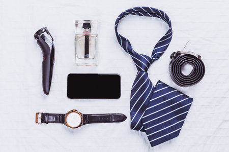 Grooming essentials and accessories arranged on a white surfaceの写真素材