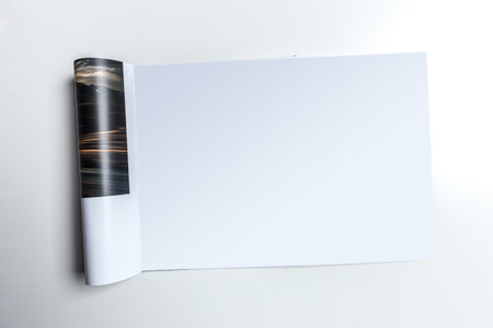 Blank sketchbook with turned page revealing empty space for creativity in art