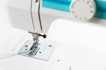 Sewing machine operated for creative projects in a well-lit workspace