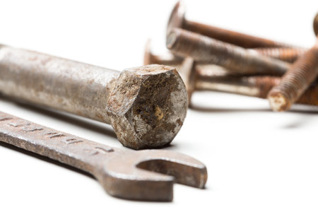 Tools scattered on a white surface ready for mechanical work and repair projectsの写真素材