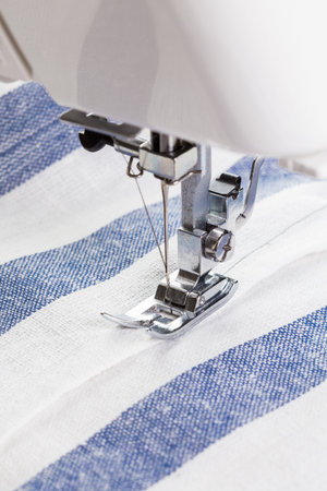 Crafting fabric with precision using a sewing machine on striped material