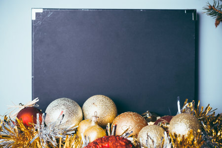 Holiday decorations with festive ornaments and a blank background for seasonal display