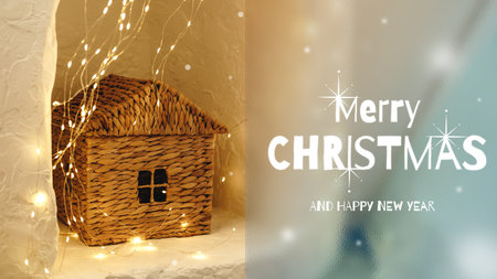 Warm Christmas decoration with a cozy house and sparkling lights for holiday celebrationsの写真素材