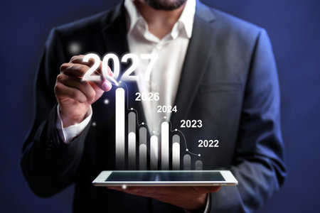 Business professional analyzing growth trends for future planning through digital graphsの写真素材