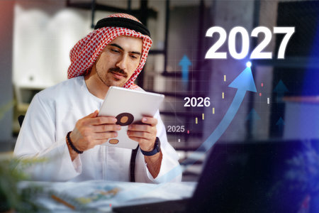 Man in traditional attire analyzes data trends for business growth until 2027