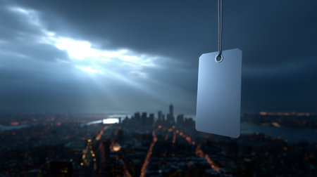 Dark sky above cityscape with hanging blank tag during an ominous eveningの素材