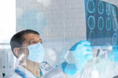 Doctor examines brain scans in modern hospital setting during the day