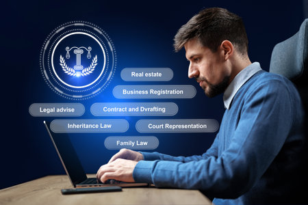 Legal expert assists clients with various services using a laptop in a professional settingの写真素材