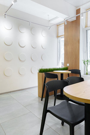 Modern cafe interior with minimalist design and natural light during daytime