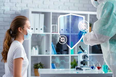 Health professional conducts a virtual consultation with a patient in a modern lab settingの写真素材