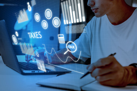 Working on tax planning with digital tools and financial data analysisの写真素材