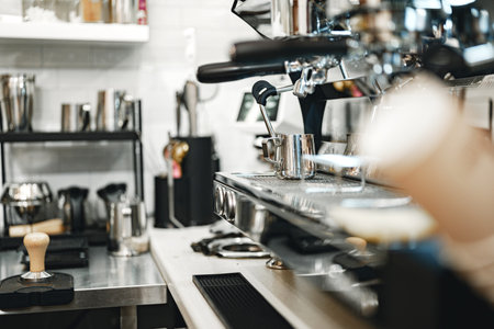 Coffee preparation station in a modern cafe with stainless steel equipment and toolsの写真素材