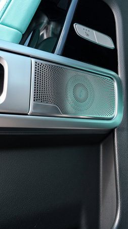 Modern car interior detail showing speaker and control features in luxury vehicle