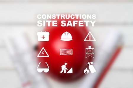 Construction site safety symbols displayed on a red background for workers awarenessの写真素材