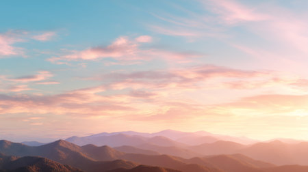 Colorful sunset over layered mountain peaks in serene landscapeの素材