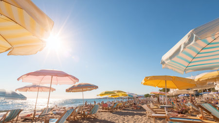 Bright beach scene with colorful umbrellas under clear blue sky in sunny weatherの素材