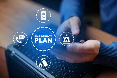 Developing an emergency plan while using a smartphone and laptop in a workspace setting