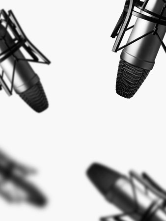 Podcast recording session with multiple microphones in a studio settingの写真素材