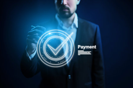 Completing a banking invoice payment with a digital confirmation checkmark on the screenの写真素材