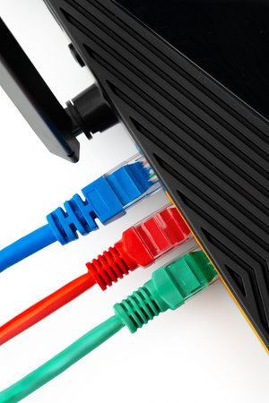 Network router with colored Ethernet cables connected for internet access and data transfer