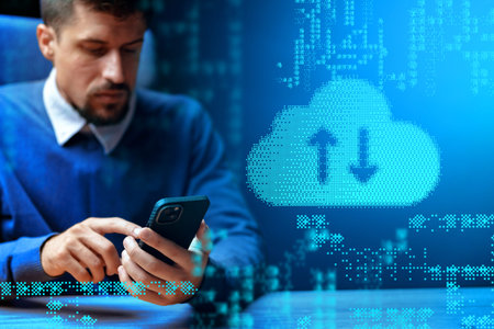 Man using smartphone to transfer data in digital workspace on a workday afternoon