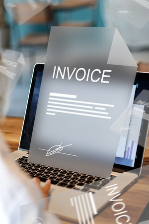 Banking invoice payment process on a laptop during daytime at a workspace