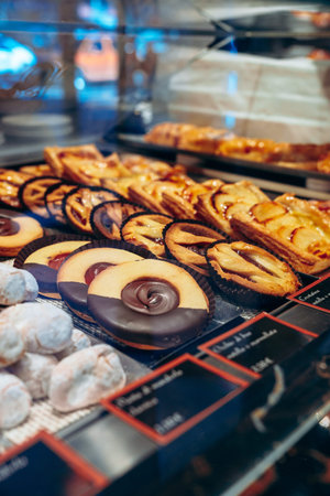 Fresh variety of pastries on display in a bakery during the afternoon