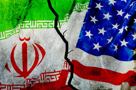 Conflict between Iran and USA represented by broken flags depicting tensions and disagreementsの写真素材