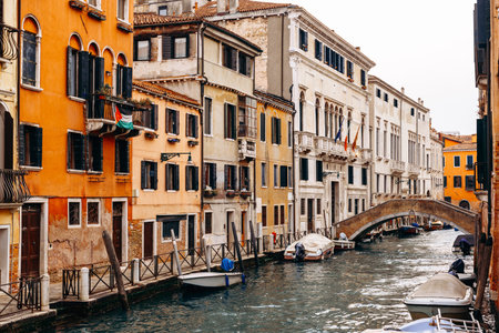 Canals and buildings in Venice show everyday life in Italy during the early morning