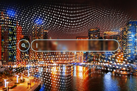 City skyline with digital elements overlaid at night near the water