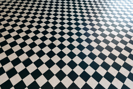 Checkerboard floor design with black and white squares in a modern setting
