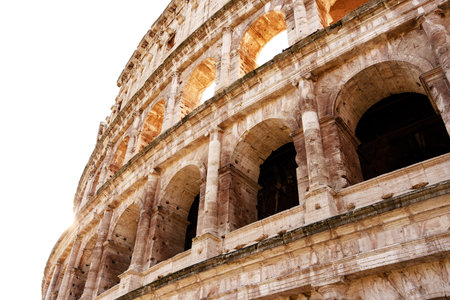 Tourists explore the ancient architecture of the Colosseum in Rome during daytime hours