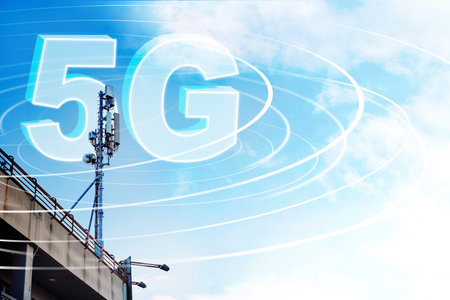 5G internet tower on a clear day with signal waves around it in an urban area