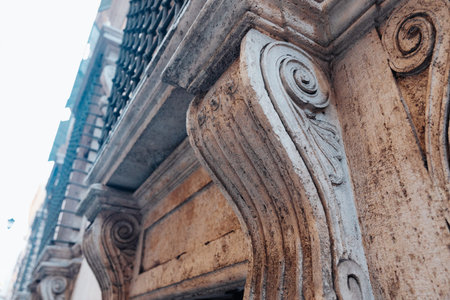 Decorative architecture details found in a historic building in an urban area during daylight