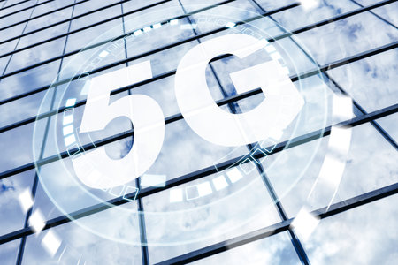 5G internet technology shows on a modern building with reflective glass windows