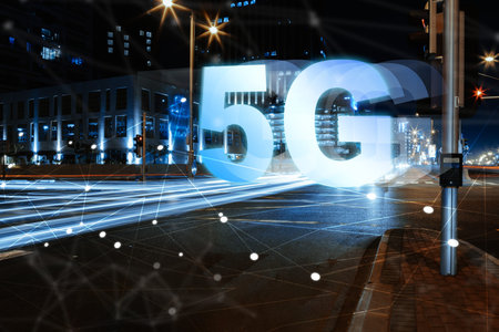5G internet technology on display at a city street intersection at night