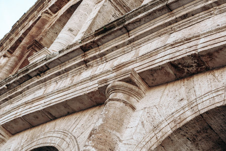 Detail of the structure showing stonework at the ancient Roman Colosseum in Italy during the dayの写真素材