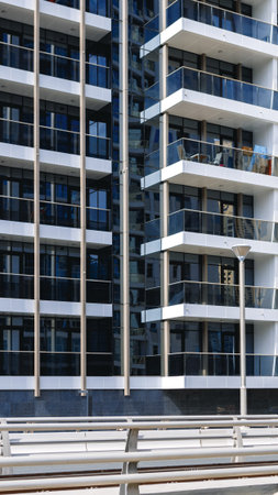 Modern building design with multiple balconies and glass facades showing urban architecture