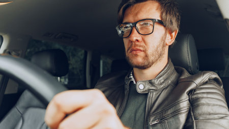 Driver focused on the road during a day trip in an urban area