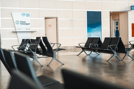 Empty waiting area with charging stations and free Wi-Fi available in a public space
