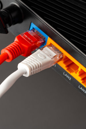 Connecting ethernet cables to a network router in a home office setup
