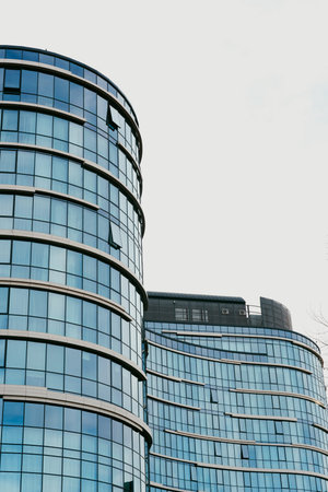 Modern buildings with glass facades in a city at midday on a clear sky