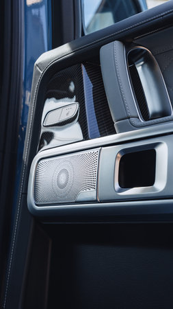 Close look at a modern car door speaker with stylish design and advanced features