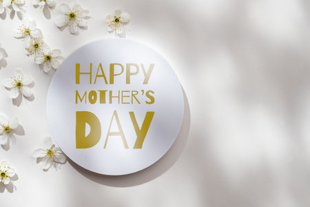 Celebrating Mothers Day on May 10 with flowers and a greeting sign