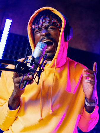Musician performs live with microphone under colorful stage lights in a studio setting