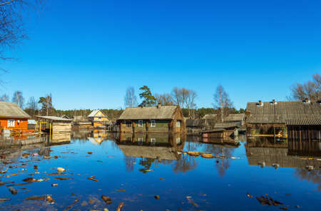 Flooded homes. Spring flood. Maksatikha 2013. Volchina river overflowed. Spring flood. Tver region.の写真素材