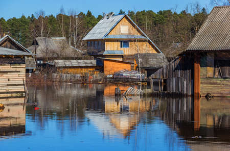 Flooded homes. Spring flood. Maksatikha 2013. Volchina river overflowed. Spring flood. Tver region.の写真素材